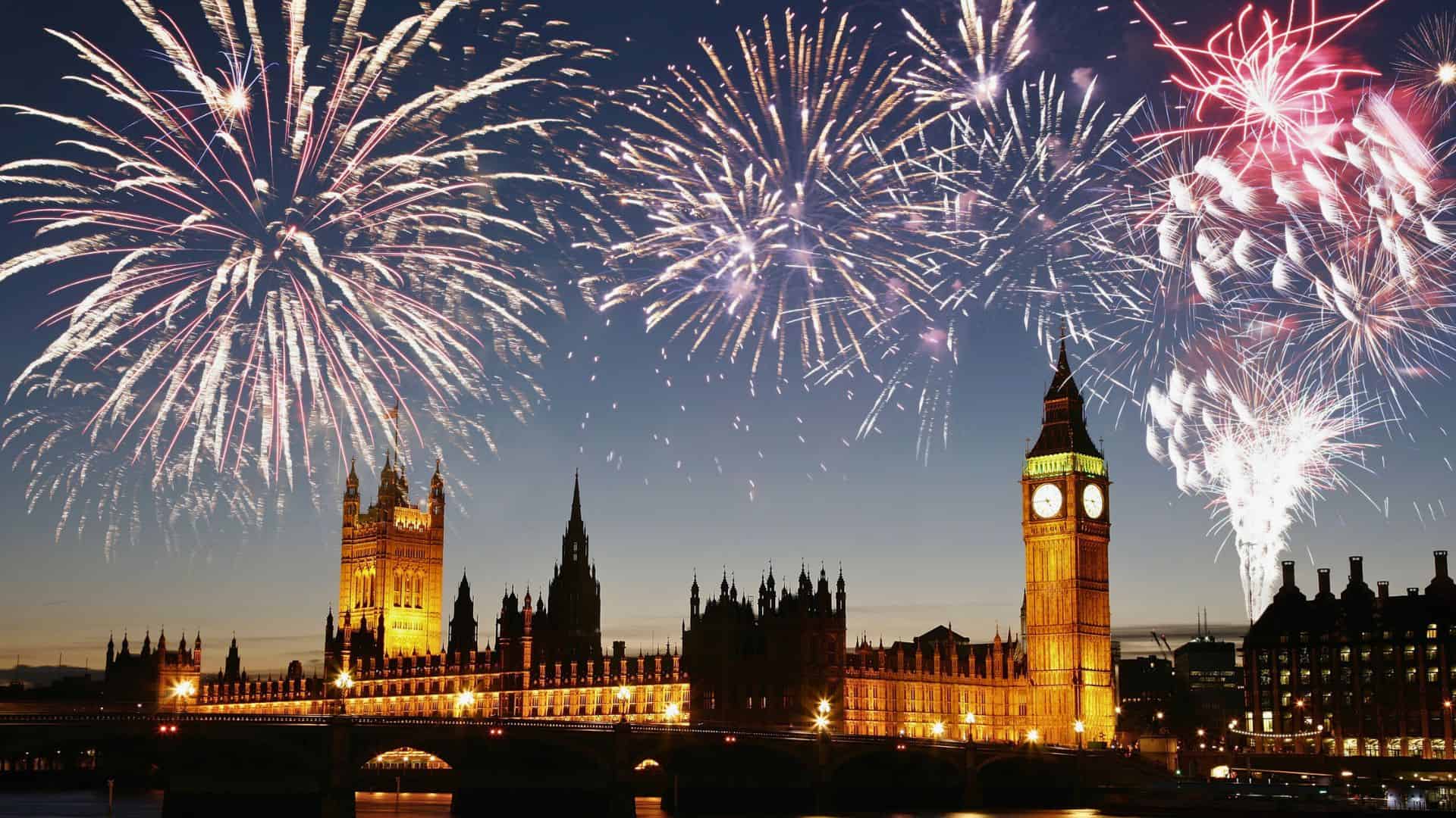 Fireworks light up the night sky over Big Ben and the Houses of Parliament in London.