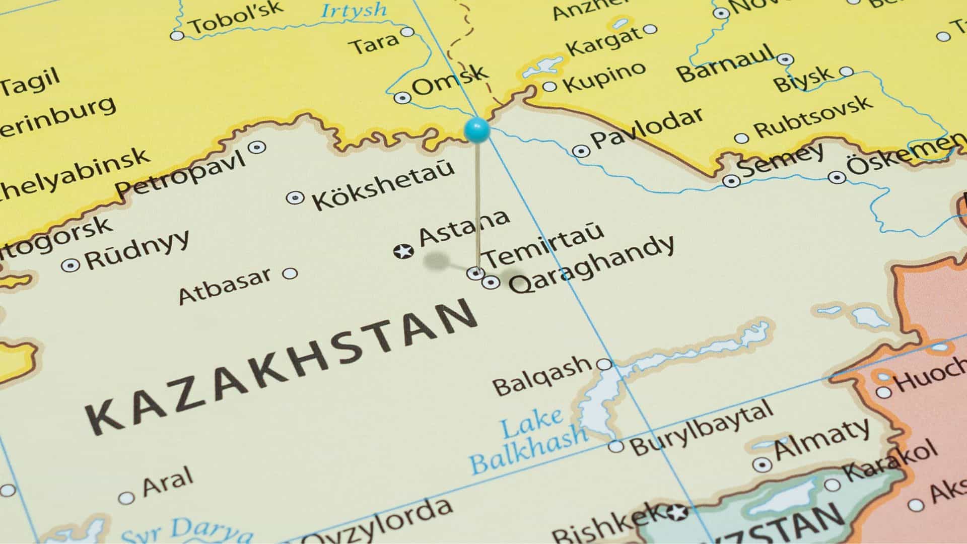 Map of Kazakhstan with a blue pushpin marking a location near Astana, surrounded by cities and labeled regions.