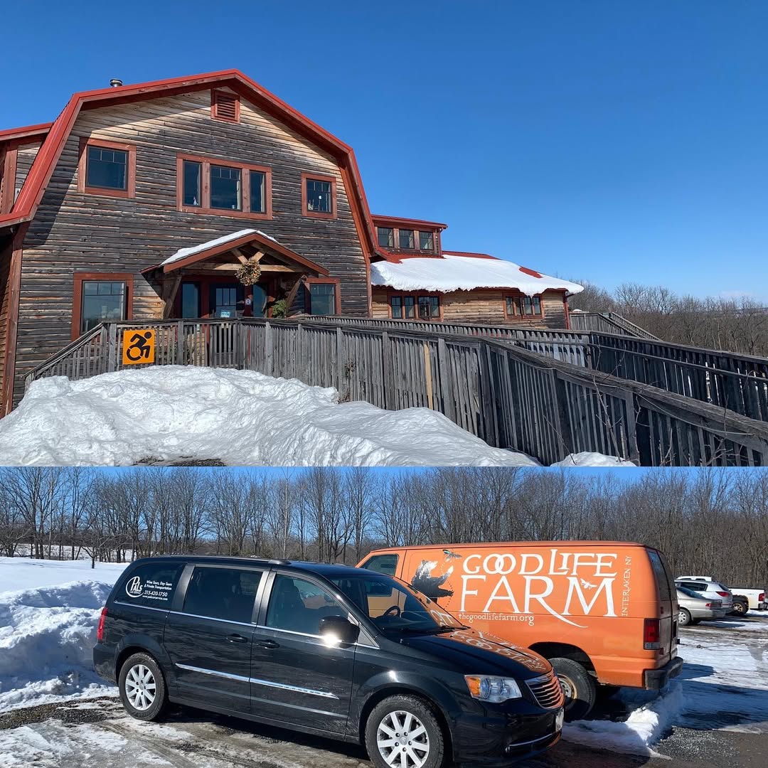 A rustic barn, snow, and Good Life Farm vans parked outside on a sunny winter day—an inviting scene for Finger Lakes Wine Tours.