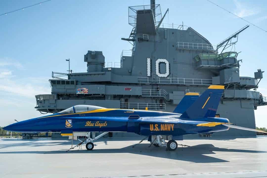 A Blue Angels U.S. Navy jet is parked on an aircraft carrier deck with the number 10 in the background—an exciting highlight among things to do in Charleston with kids.