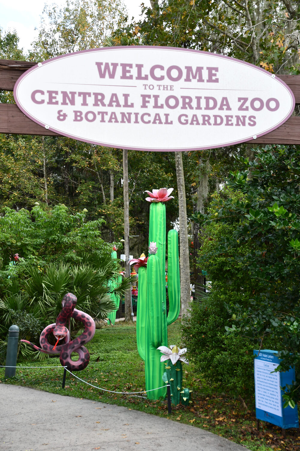 Entrance sign for Central Florida Zoo & Botanical Gardens with cactus and flowers nearby—a perfect photo spot while exploring fun things to do in Orlando with kids.