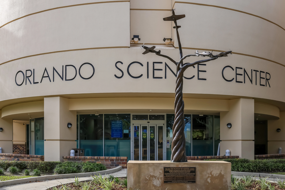 Front entrance of Orlando Science Center with a metal sculpture of airplanes in front—a fantastic spot to capture memories while exploring things to do in Orlando with kids.