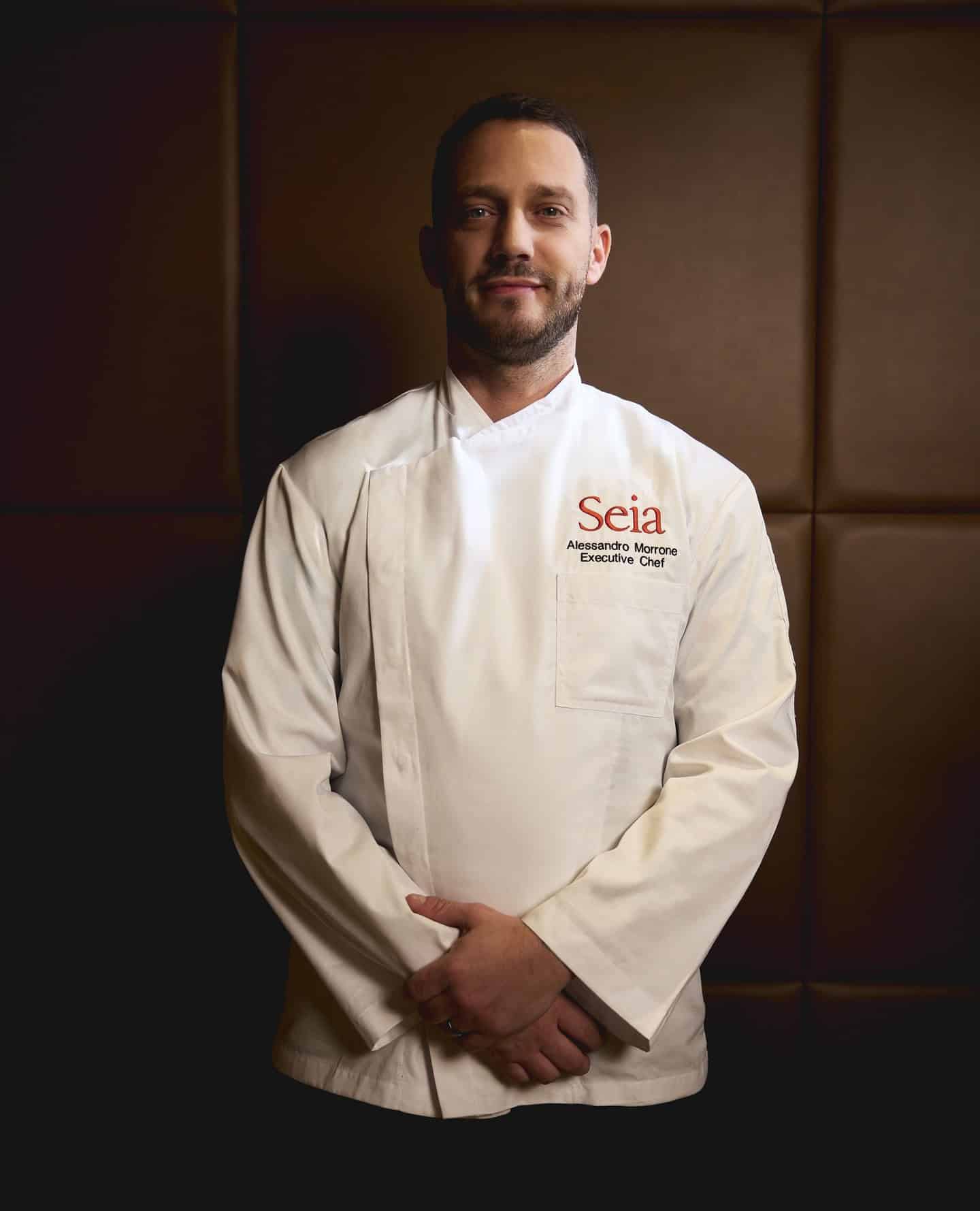 Alessandro Morrone, Executive Chef at Seia, wearing a white chef&rsquo;s coat for a Seia Miami review.